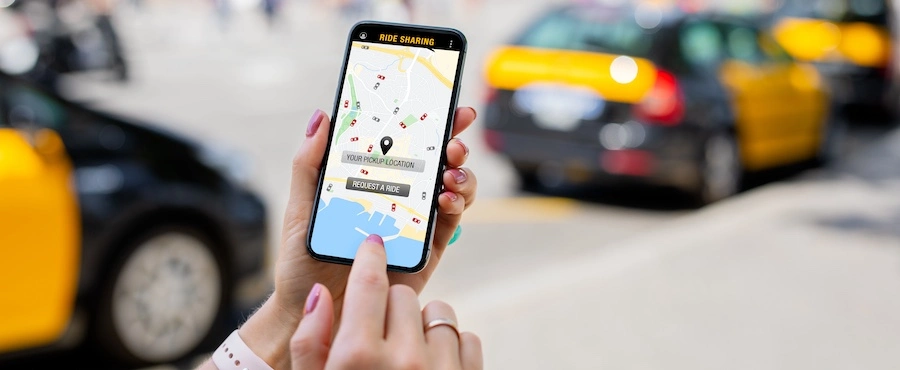 A woman calling an Uber represents a rideshare accident lawyer.