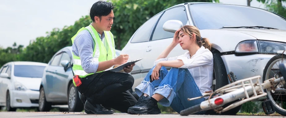 A woman is in need of a bicycle accident lawyer after being in an accident.
