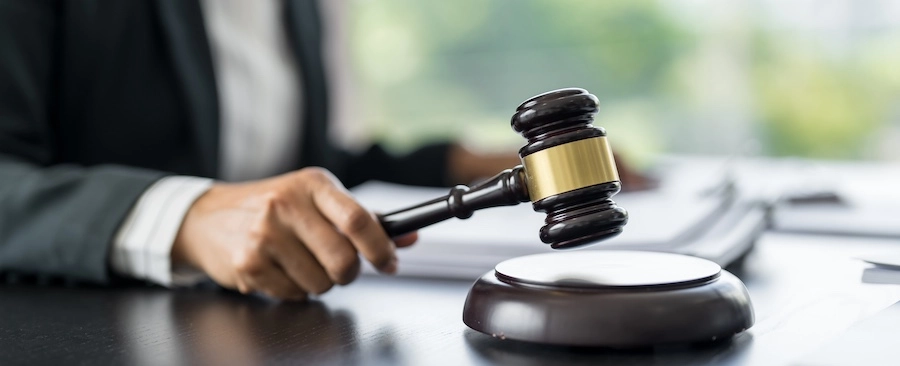 A bicycle accident lawyer is working at his desk at BOB Law Firm.
